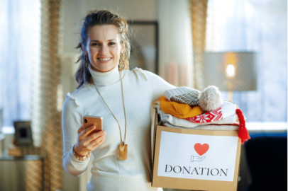 Woman carrying a donation box.