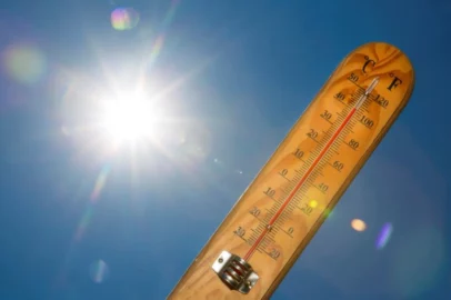 thermometer with the sun in the background