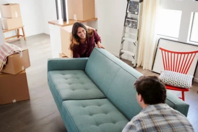 Couple moving a couch