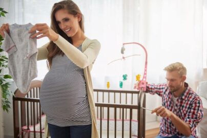 Woman and man preparing a nursery.