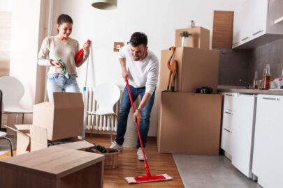 Man and woman cleaning a room.