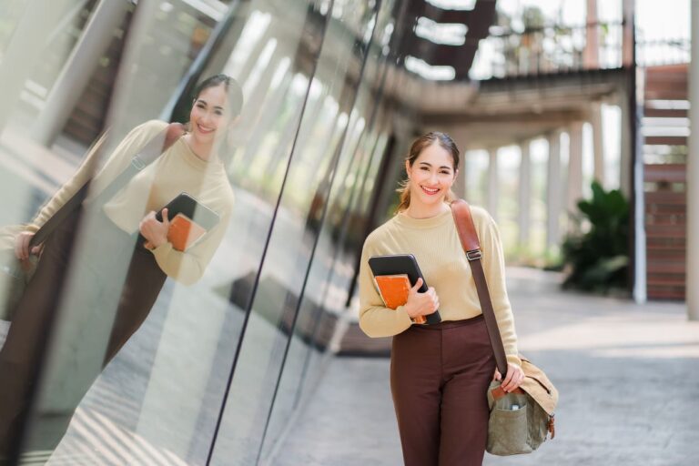 A student is walking through the city.